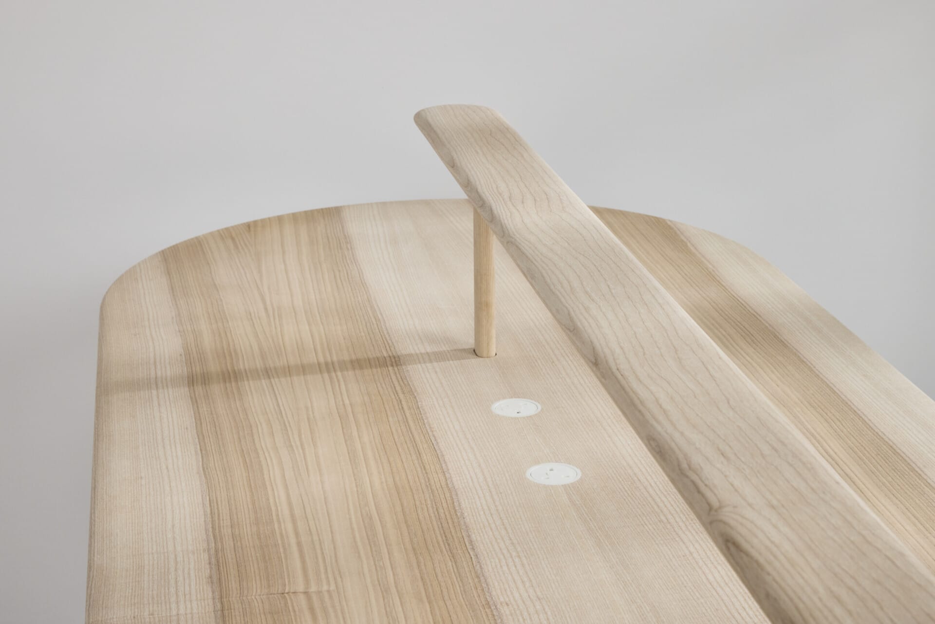 Soft curves of the AYA reading light and table designed by Foster + Partners